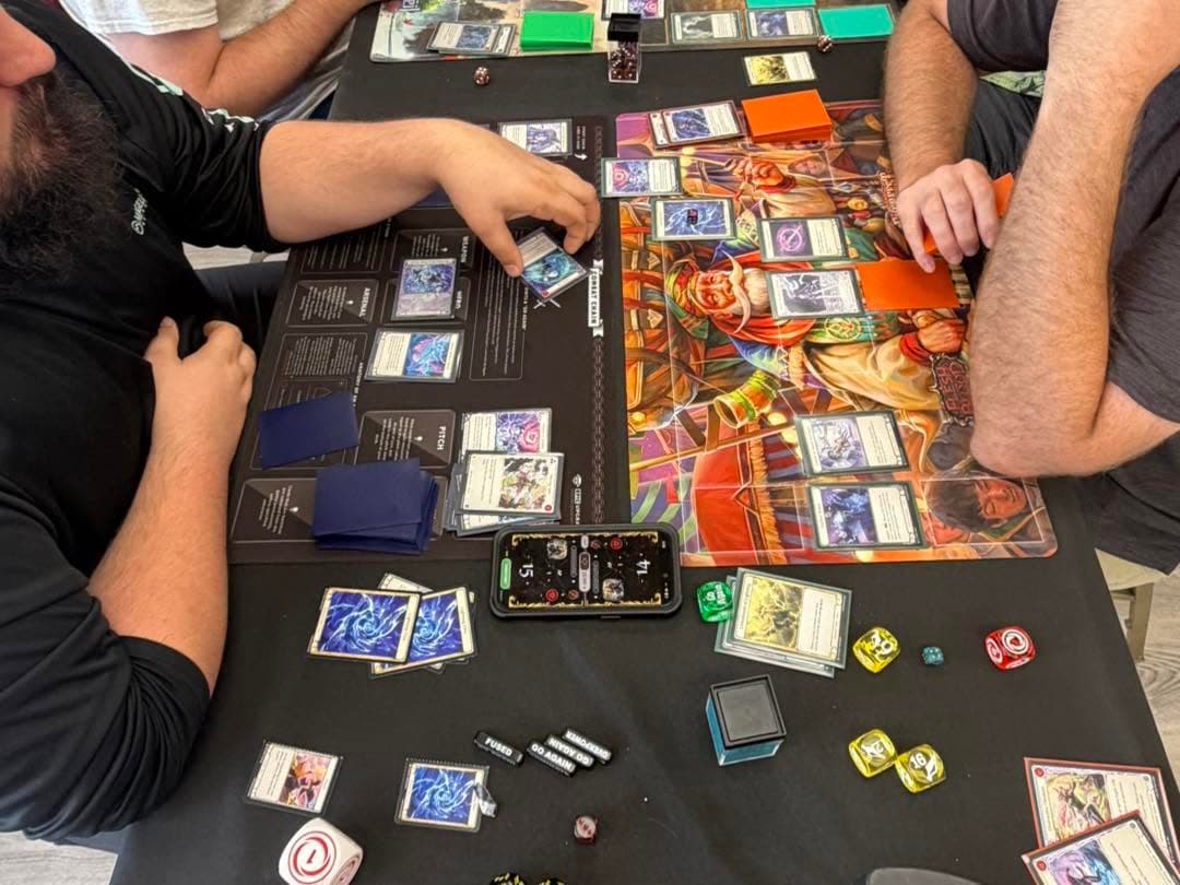 Players mid-game at Magnolia TCG Exchange